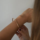 Signature Bangle with a softly sculpted organic silhouette, available in sterling silver, gold vermeil and rose gold vermeil.