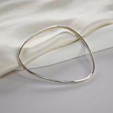 Signature Bangle with a softly sculpted organic silhouette, available in sterling silver, gold vermeil and rose gold vermeil.
