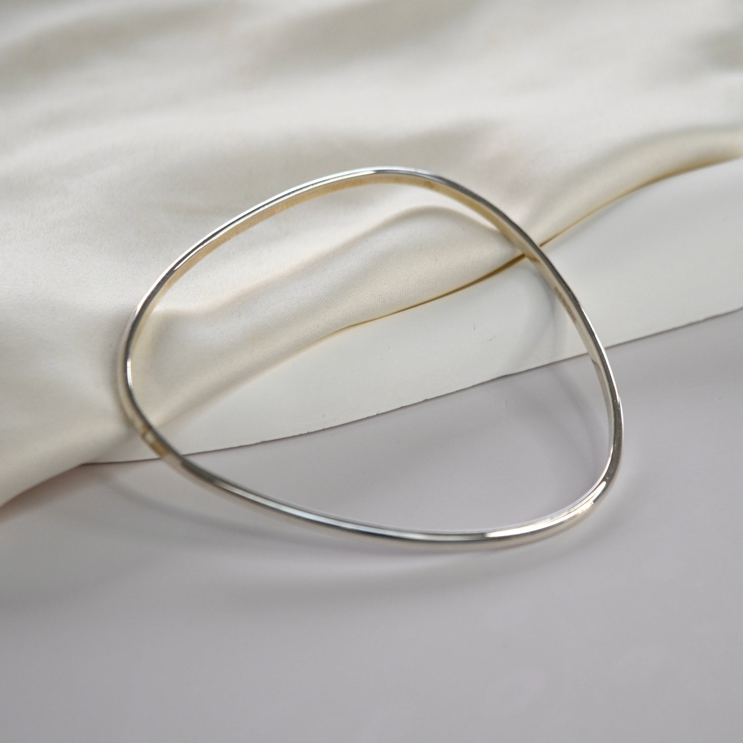 Signature Bangle with a softly sculpted organic silhouette, available in sterling silver, gold vermeil and rose gold vermeil.