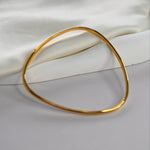 Signature Bangle with a softly sculpted organic silhouette, available in sterling silver, gold vermeil and rose gold vermeil.