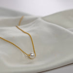 Single Pearl Choker Necklace with a cultured freshwater pearl on a delicate gold vermeil chain.