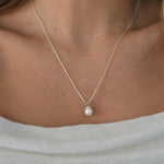 White Gold Drop Pearl Necklace with a lustrous freshwater pearl pendant on a delicate sterling silver chain.
