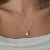 White Gold Drop Pearl Necklace with a lustrous freshwater pearl pendant on a delicate sterling silver chain.