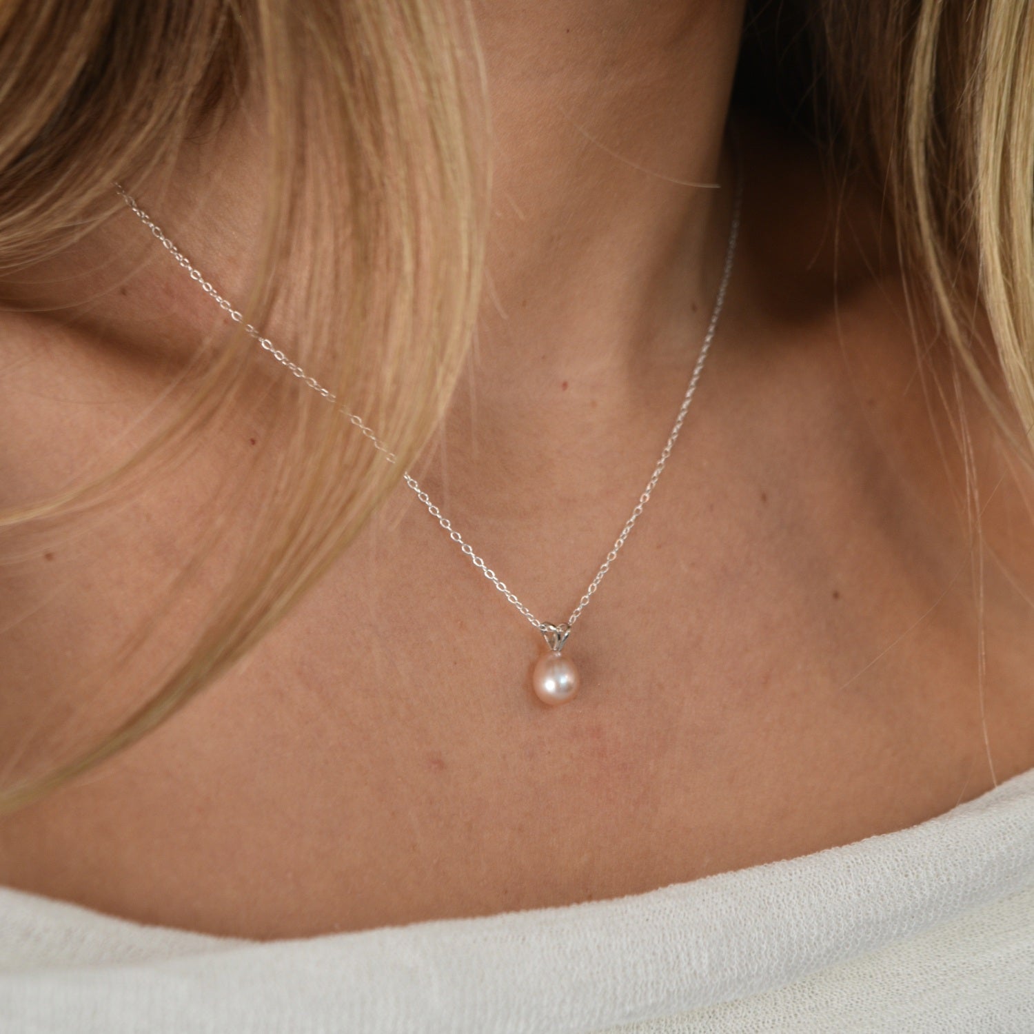 White Gold Drop Pearl Necklace with a lustrous freshwater pearl pendant on a delicate sterling silver chain.