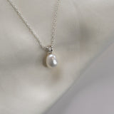 White Gold Drop Pearl Necklace with a lustrous freshwater pearl pendant on a delicate sterling silver chain.
