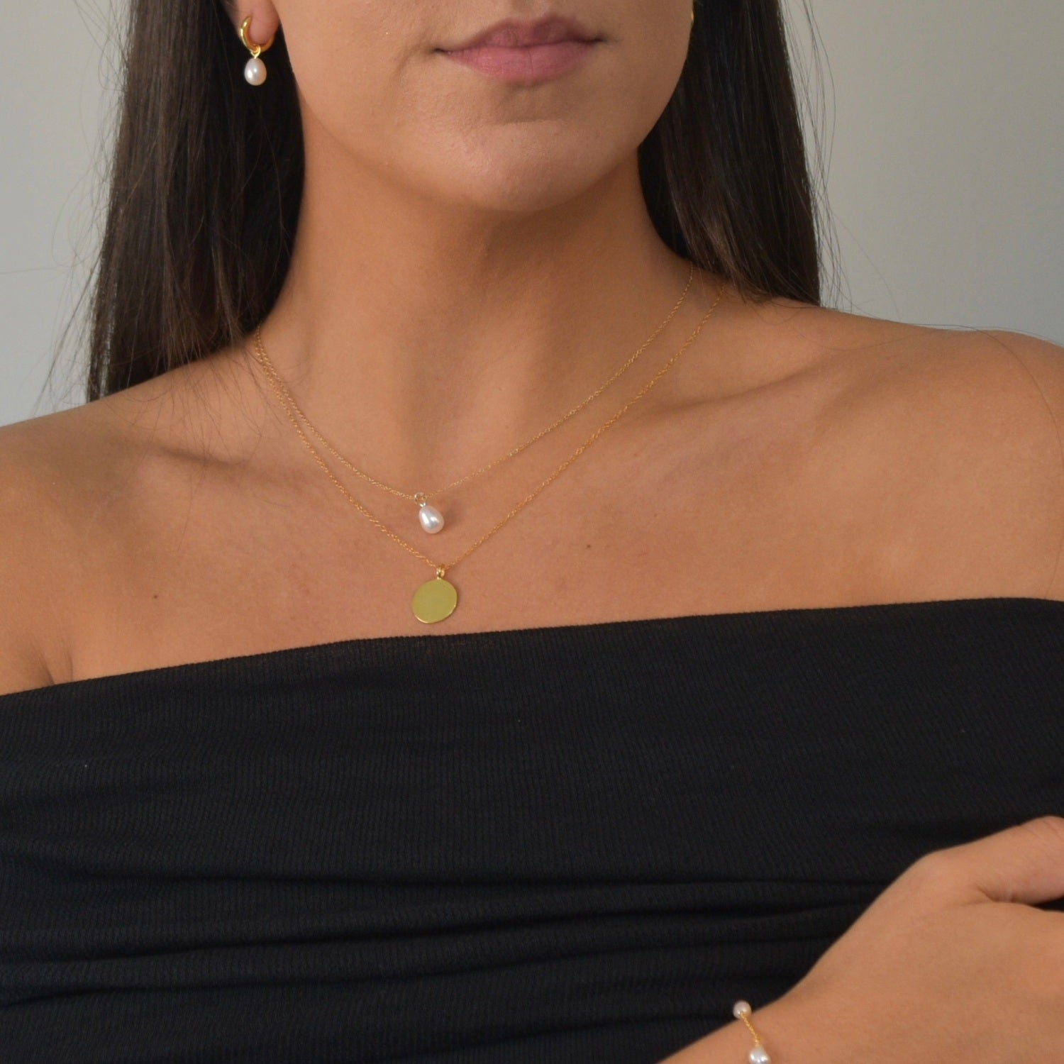 Yellow Gold Pearl Drop Necklace with a cultured freshwater pearl pendant on a delicate gold chain.